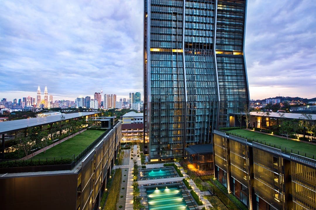 The Capers: the tower at dusk, with the city behind
